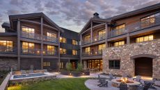 Courtyard with Hot Tub Terrace and Fire Pit at Rusty Parrot Lodge and Spa