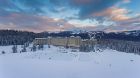 Winter Aerial View of Fairmont Chateau Lake Louise with ski hill
