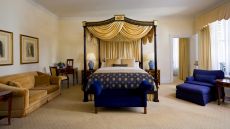 bedroom four post bed blue yellow