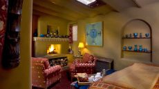 bedroom king bed sitting area fireplace