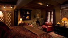 bedroom king bed sitting area fireplace