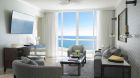 002585 grand deluxe three bedroom ocean front suite Acqualina Resort and Spa on the Beach .