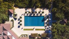 Clubhouse and Main Swimming Pool Aerial Amanpulo 2024