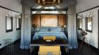 Bed at Belmond Eagle Island Lodge