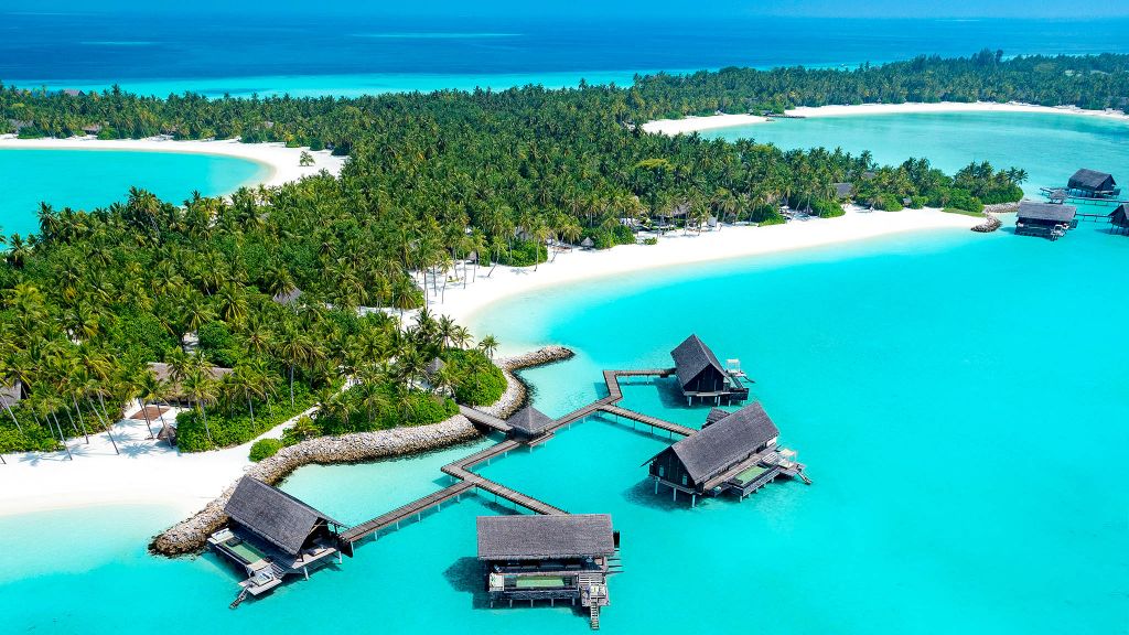 One&Only Reethi Rah overwater villas with private pools aerial view North Malé Atoll Maldives