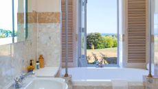 Cottage bathroom window portrait at Wharekauhau