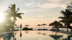 COMO Cocoa Island Poolside Female at sunset COMO Cocoa Island