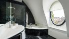 Belgravia Suite Bathroom with round window COMO The Halkin