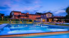 Pool L Oliveto and Villa Hombert by night Villa La Massa