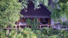 See more information about Jao Camp exterior jungle villa