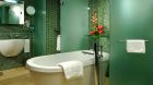 green bathroom with tub