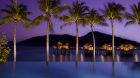 infinity pool overwater bungalows twilight