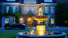 See more information about Longueville Manor exterior fountain night