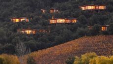 exterior villas fron vineyard evening at Clos Apalta Residence