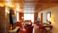 Deluxe suite sitting area with fireplace