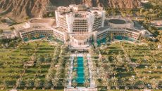 See more information about Al Bustan Palace, a Ritz-Carlton Hotel Aerial property view