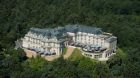 Hotel exteror surrounded by trees