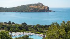 See more information about Cape Sounio, a Grecotel Resort to Live poolscape with the views of the Aegean sea and the temple of Poseidon at Cape Sounio