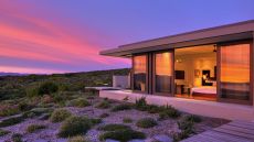 the villa lit by the soft light of sunset