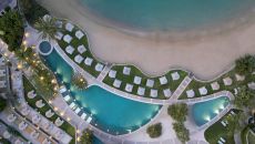 main pool kids pool night Elounda Peninsula All Suite Hotel