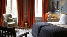 See more information about Hotel Verhaegen bedroom and sitting area