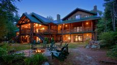 See more information about Trout Point Lodge exterior with fire pit