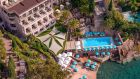 See more information about Tiara Miramar Beach Hotel & Spa aerial facade with beach Tiara Miramar Beach