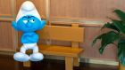 smurf character sitting on the bench