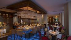 dinning room with kitchen view at The Leela Palace Udaipur