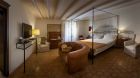 spacious bedroom with couch