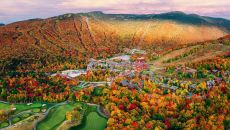 Fall colours, drone view of the The Lodge at Spruce Peak