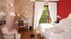 bedroom with leafy garden view