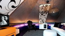 suite with sloped ceilings