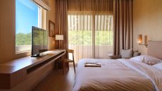 bright bedroom with garden view