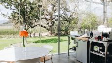 A garden view through the kitchen window at Babylonstoren