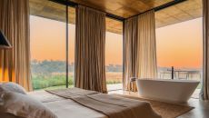 guestroom with bathtub at Herdade Da Malhadinha Nova