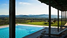 Relax poolside with a Tuscan view
