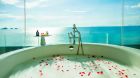 club panoramic ocean view suite bathtub