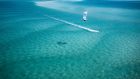beach kite surfing in the ocean anantara bazaruto island resort and spa