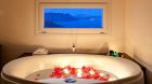 bathtub rose petals at Canaves Oia Hotel