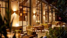 Tfaya brasserie arabesque terrace tables outdoor night lights vegetation setup at Park Hyatt Marrakech