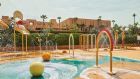 kidsclub outdoor watergames splashpad plasticpalm balloonfountain entertainmentarea vegetation resort waterparkon at Park Hyatt Marrakech