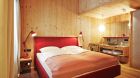 wooden bedroom at Ziller Lodge