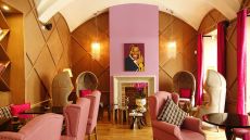 Bright pink room at Aria Hotel