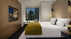 Signature Suite Bedroom Evening City View