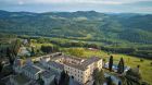 See more information about Castello di Casole, A Belmond Hotel, Tuscany Aerial exterior