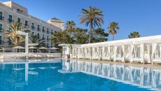 Exterior pool with cabanas