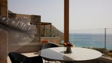 Cayo Rooms Balcony Sea View Dining Table at Cayo Exclusive Resort