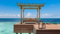 Two Queen Bedded Grand Reef Villa Swing Daybed at Waldorf Astoria Maldives Ithaafushi