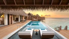 Two Queen Bedded Reef Villa Pool at Sunset at Waldorf Astoria Maldives Ithaafushi